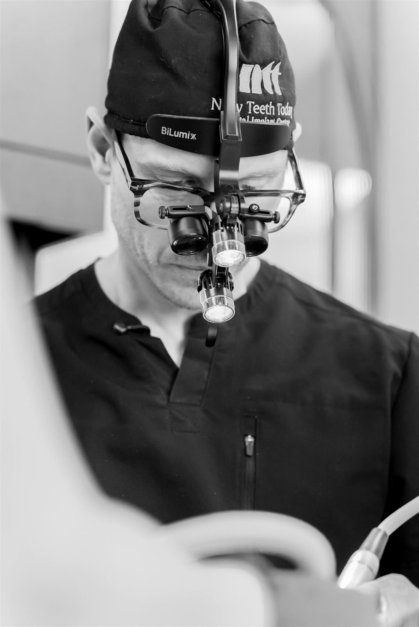 Dr. Webster in surgical loupes.