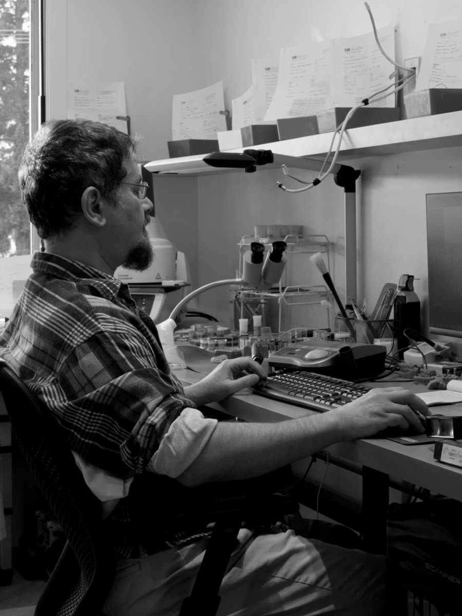 A technician working at the lab bench.